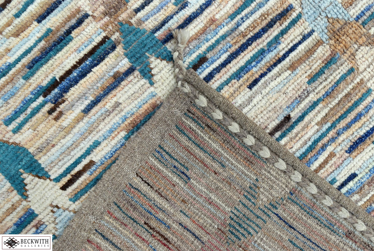 Close-up of a textured rug with geometric pattern in earthy tones